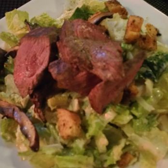 O'Bricks - Portabella mushrooms and steak over Caesar salad - New American Near Me - Bradenton, Florida O'Bricks - Portabella mushrooms and steak over Caesar salad - New American Near Me - Bradenton, Florida