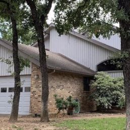This was the house when we purchased it a few months ago. The garage door panel of windows was too low for me to feel comfortable.