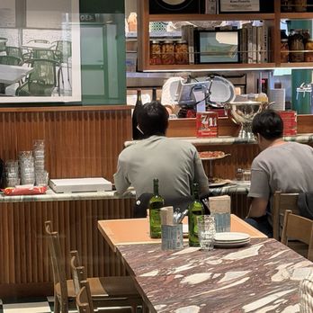 Rose Pizzeria - The empty tables where we could have sat. This was empty when we entered - Pizza Near Me - San Francisco, California