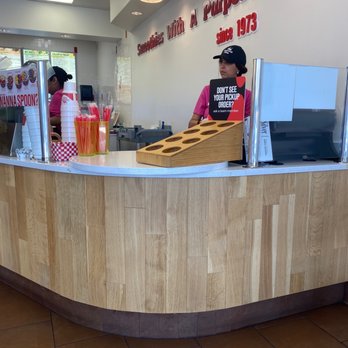 Smoothie King - a woman behind the counter - Health Markets Near Me - Houston, Texas