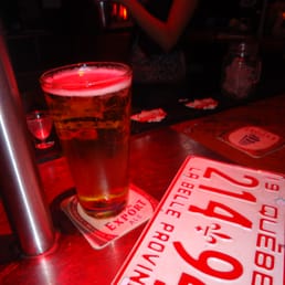 a pint of beer next to a license plate