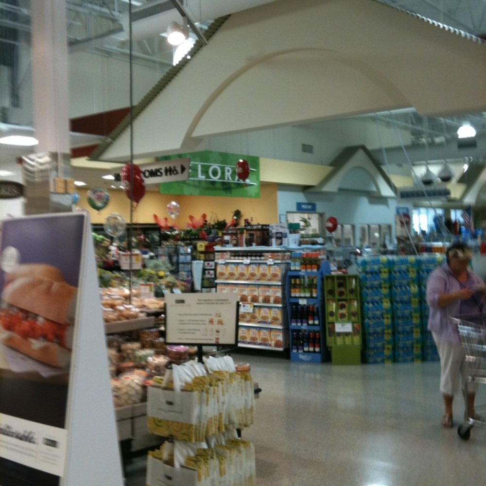 a woman shopping in a grocery store a woman shopping in a grocery store