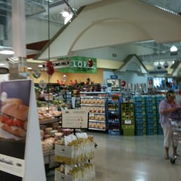 a woman shopping in a grocery store a woman shopping in a grocery store