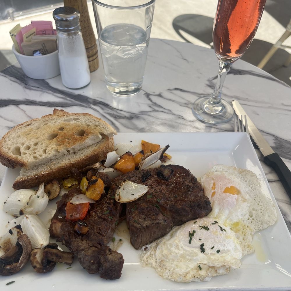 Steak and Eggs! ribeye cooked perfectly! So tender and juicy, and Rosé for good measure