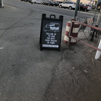 Greek N More - a sign on the side of the road - Food Trucks Near Me