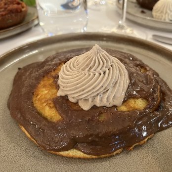Georgie - Banana Pancakes with Brown Butter, Pecan Praline, Chantilly. Too much chocolatey sauce. - New American Near Me - Dallas, Texas