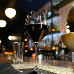 Siren Restaurant & Bar - A glass of red wine, perfect alongside seafood and dinner favorites.