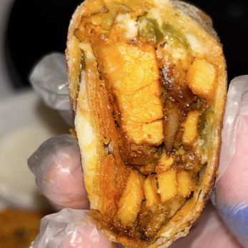 Salam’s Grill - Close-up of the innards of a chicken shawarma wrap. - Food Trucks Near Me - Austin, Texas Salam’s Grill - Close-up of the innards of a chicken shawarma wrap. - Food Trucks Near Me - Austin, Texas