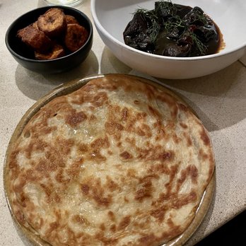 Canje - Fried sweet plantains (left), Guyanese style Roti (center), wild boar (right) - Caribbean Near Me - Austin, Texas Canje - Fried sweet plantains (left), Guyanese style Roti (center), wild boar (right) - Caribbean Near Me - Austin, Texas