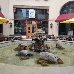 Right next to the Turtle fountain. There are tables outside to sit/eat/drink at. Inside and Upstairs there are more tables. Right next to the Turtle fountain. There are tables outside to sit/eat/drink at. Inside and Upstairs there are more tables.