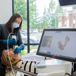 Berg Dental Group - Dental hygienist performing a digital intraoral scan on a patient at berg Dental Group, advanced dental technology and restorative dentistry