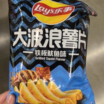 M2M Mart - a hand holding a bag of chips - International Grocery Near Me - Seattle, Washington M2M Mart - a hand holding a bag of chips - International Grocery Near Me - Seattle, Washington