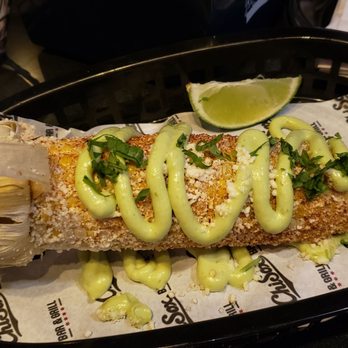 ChiSox Bar & Grill - Smoked elote ($8): corn on the cob with avocado aioli, cotija cheese, paprika, and cilantro - Bars Near Me - Chicago, Illinois