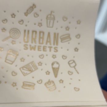 Urban Sweets - a hand holding a box of treats - Ice Cream & Frozen Yogurt Near Me Urban Sweets - a hand holding a box of treats - Ice Cream & Frozen Yogurt Near Me