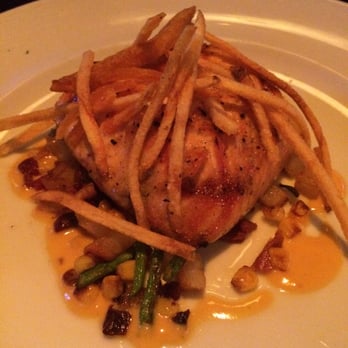 Marlow's Tavern - Grilled salmon with crispy bacon a scallion Succotash, buerre blanc and crispy potato sticks - New American Near Me - Orlando, Florida Marlow's Tavern - Grilled salmon with crispy bacon a scallion Succotash, buerre blanc and crispy potato sticks - New American Near Me - Orlando, Florida