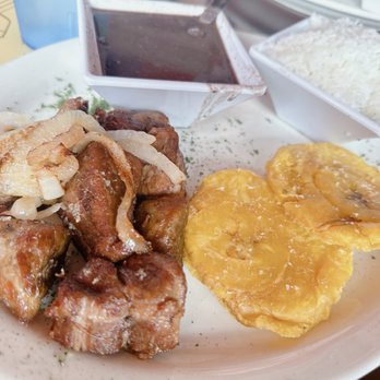 Las Palmas Cuban Restaurant - Masitas de Puerco al Ajillo with Complimentary rice & 2 sides - Black Beans & Tostones - Cuban Near Me - Mount Dora, Florida Las Palmas Cuban Restaurant - Masitas de Puerco al Ajillo with Complimentary rice & 2 sides - Black Beans & Tostones - Cuban Near Me - Mount Dora, Florida