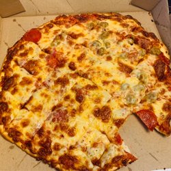 Jimmy's Pizza - Couldn't resist having a quick slice before I took the photo. Tough photo to take because my hands were shaking with excitement!