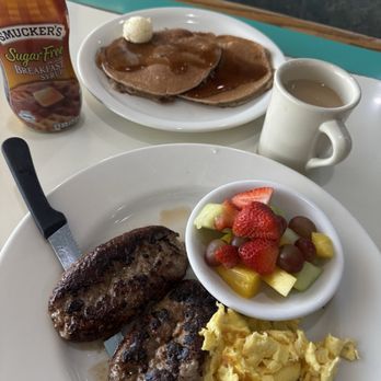 Spring House Restaurant - Wheat pancakes with Italian sausage eggs and fruit. - New American Near Me - Hesperia, California