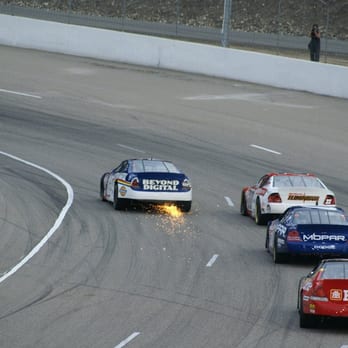 Motoplex Speedway - a group of cars racing on a track - Automotive Near Me - Vernon, British Columbia