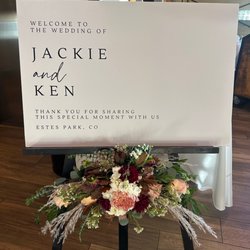 Floral Design of Europe - Our welcome sign. She also re-used the arrangement for our ceremony sign.