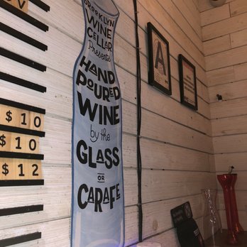 Brooklyn Wine Cellar - a glass of wine on the wall - Beer, Wine & Spirits Near Me - Brooklyn, New York