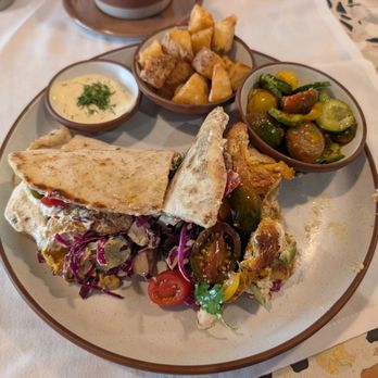 Clio - Lunch Wrap and I added an extra tomato/cucumber salad. Crispy Potatoes Curry Yogurt Chicken Espresso with fig syrup and cream. - Mediterranean Near Me - Omaha, Nebraska Clio - Lunch Wrap and I added an extra tomato/cucumber salad. Crispy Potatoes Curry Yogurt Chicken Espresso with fig syrup and cream. - Mediterranean Near Me - Omaha, Nebraska