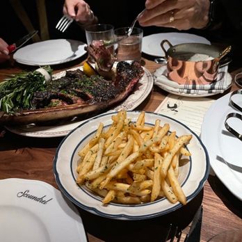 Scoundrel - Tomahawk Rib Eye! with three sauces, duck fat fries and greens! - French Near Me - Greenville, South Carolina Scoundrel - Tomahawk Rib Eye! with three sauces, duck fat fries and greens! - French Near Me - Greenville, South Carolina