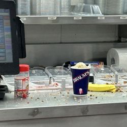 All sorts of crap on the counters next to a customer's order.