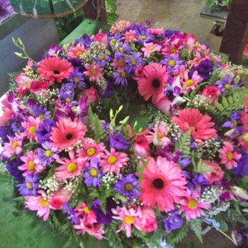 Mireya's Flowers - Mireya's Flowers fresh flower custom designed funeral wreath honors the favorite colors of the beloved departed. - Florists Near Me - Garden Grove, California