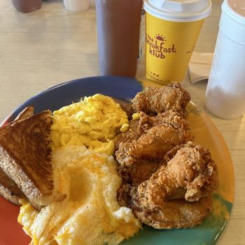 The Breakfast Klub - The wings with grits, eggs and toast. - Southern Near Me - Houston, Texas