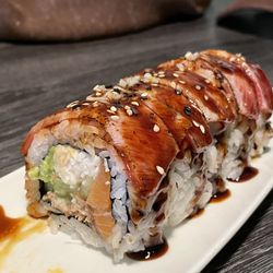 The BOMB Roll (Crab, Cucumber, Avocado, Salmon, & EEL topped w/ Seared Pepper Tuna)