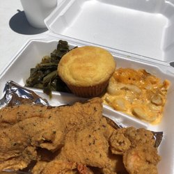 Shrimp and fish plate with greens and mac n cheese