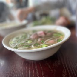 a bowl of soup on a table a bowl of soup on a table