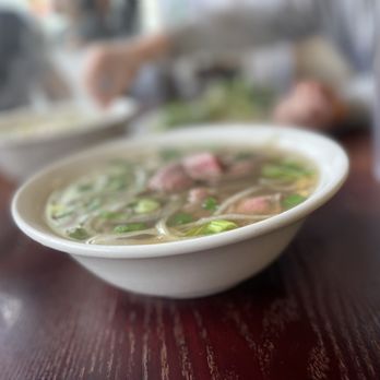 Pho Than Brothers - a bowl of soup on a table - Vietnamese Near Me - Seattle, Washington Pho Than Brothers - a bowl of soup on a table - Vietnamese Near Me - Seattle, Washington