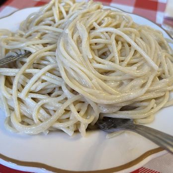 Santasiero's - Plain spaghetti with butter sauce. Cheese is on the table. - Italian Near Me - Buffalo, New York Santasiero's - Plain spaghetti with butter sauce. Cheese is on the table. - Italian Near Me - Buffalo, New York