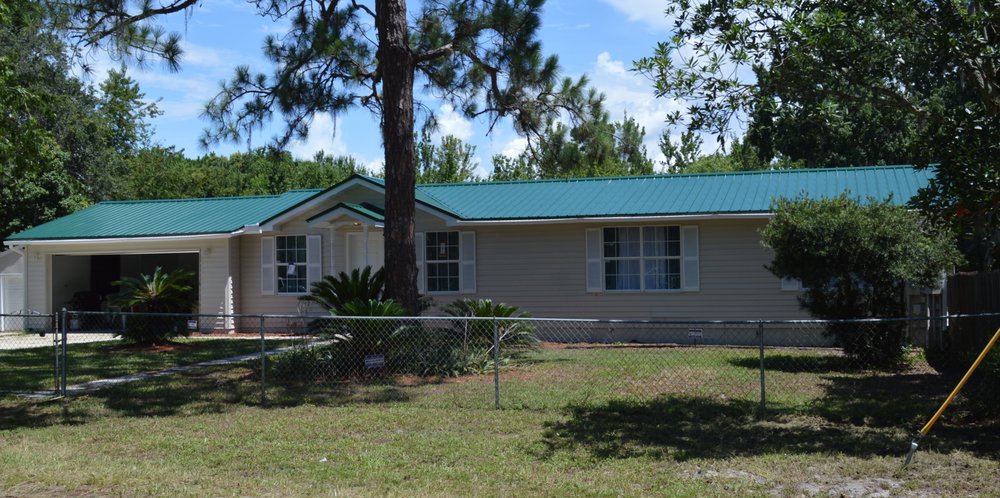 Slide of T Mark Roofing