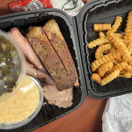 2 meat rib platter (ribs and brisket). Collard greens, fries, macaroni and cheese. 2 meat rib platter (ribs and brisket). Collard greens, fries, macaroni and cheese.