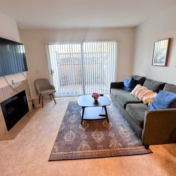 Rancho Maderas Apartment Homes - Living room area and view of the patio - Apartments Near Me - Tustin, California Rancho Maderas Apartment Homes - Living room area and view of the patio - Apartments Near Me - Tustin, California