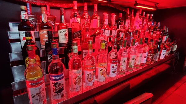 Photo of Vault Bar and Grill - Santa Ana, CA, US. bottles of alcohol on shelves