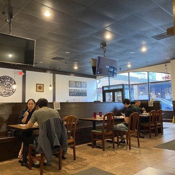 Baps - two people sitting at a table in a restaurant - Korean Near Me - East Lansing, Michigan Baps - two people sitting at a table in a restaurant - Korean Near Me - East Lansing, Michigan