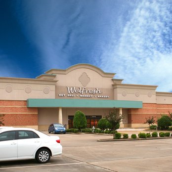 Welfresh - a white car parked in front of a store - Grocery Near Me - Sugar Land, Texas Welfresh - a white car parked in front of a store - Grocery Near Me - Sugar Land, Texas