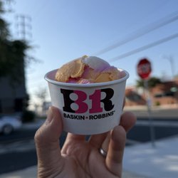 Rainbow sherbet scoop in a cup