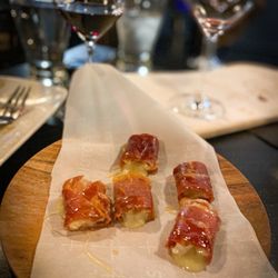 The Milieu Wine Bar - Prosciutto wrapped Brie cheese