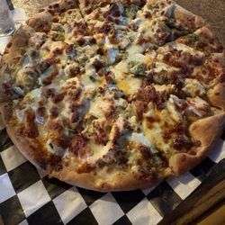 Port Orchard Pub - 16" pizza with pesto base, chicken, bacon, artichoke, & garlic. Fire!