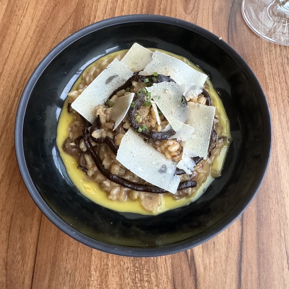 VV Tapas Lounge - a bowl of food on a wooden table - Tapas Bars Near Me - Vancouver, British Columbia VV Tapas Lounge - a bowl of food on a wooden table - Tapas Bars Near Me - Vancouver, British Columbia