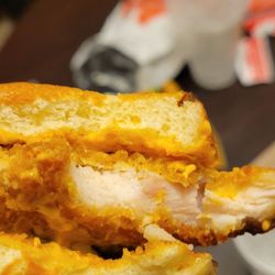 McDonald's - My wife took one bite and spit it out because parts of it were rare. You can see the pink in the chicken patty. Do better McDonald's smh