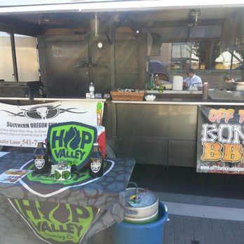 Off The Bone BBQ - a table with a beer keg - Food Trucks Near Me Off The Bone BBQ - a table with a beer keg - Food Trucks Near Me