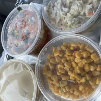 Meat Moot Smoking - To go sides including corn, mashed potatoes, cucumber and tomato salad and Cole slaw. - Smokehouse Near Me - Novi, Michigan