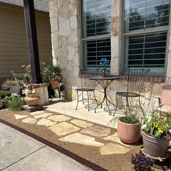 North Pearl Landscaping - a patio with a table and chairs - Landscaping Near Me North Pearl Landscaping - a patio with a table and chairs - Landscaping Near Me