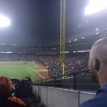 Oracle Park - My fiancé watching the game at AT&T park. - Stadiums & Arenas Near Me - San Francisco, California
